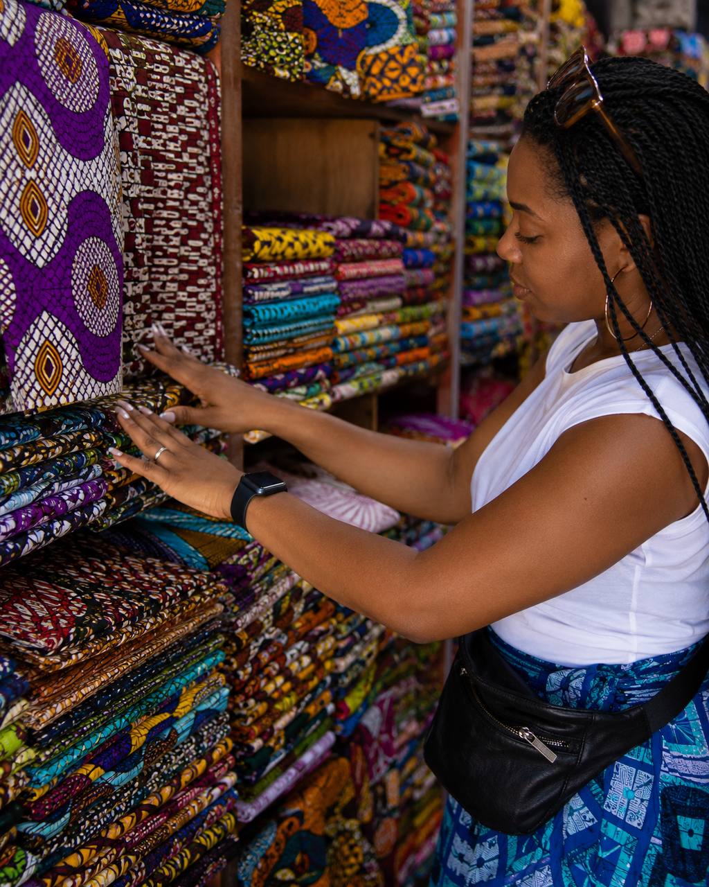 Guest choosing fabric during a curated Accra design tour